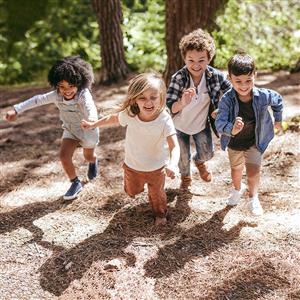 young children running outdoors