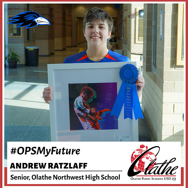 Andrew Ratzlaff holding award-winning digital artwork