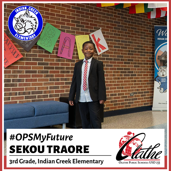 Sekou Traore standing in school lobby