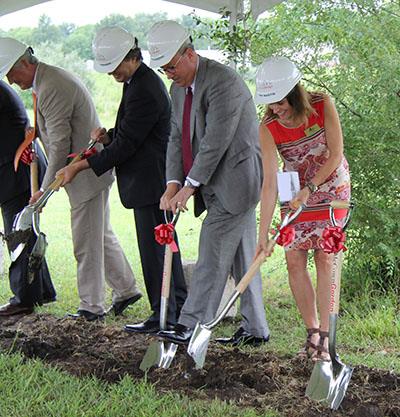 photo of administrators breaking ground for Olathe West 