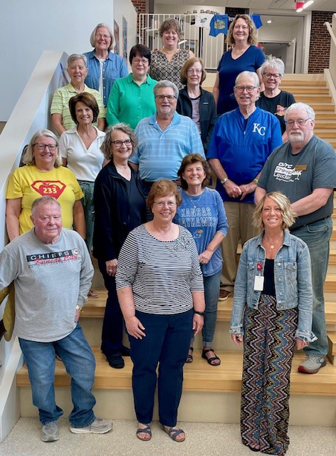 group of people standing on stairs