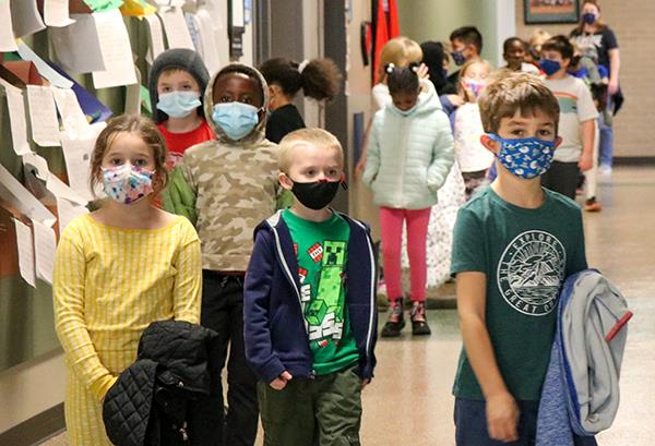 students walking in line down hallway