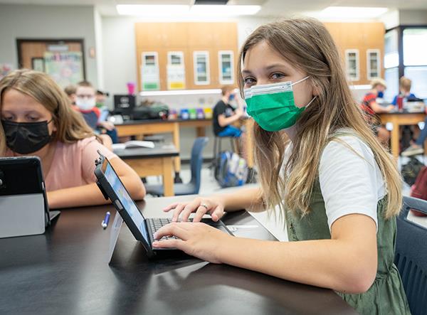 photo of middle school student at laptop