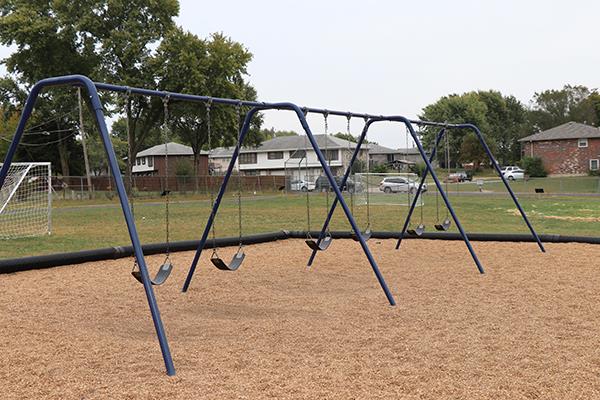 swings with pea gravel beneath