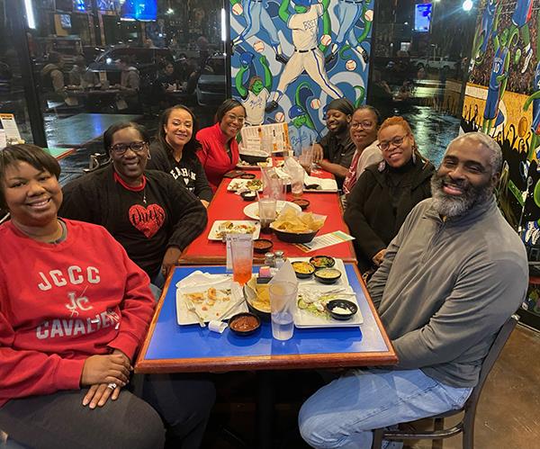 group of Black people at a restaurant