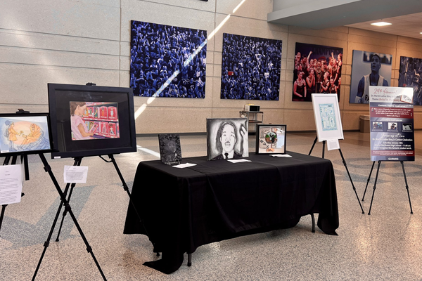 table and easels set up to display artwork